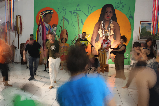 Imagem: Foto desfocada de grupo de pessoas reunidas em sala fazendo movimentos, ao fundo uma tela de pintura.
